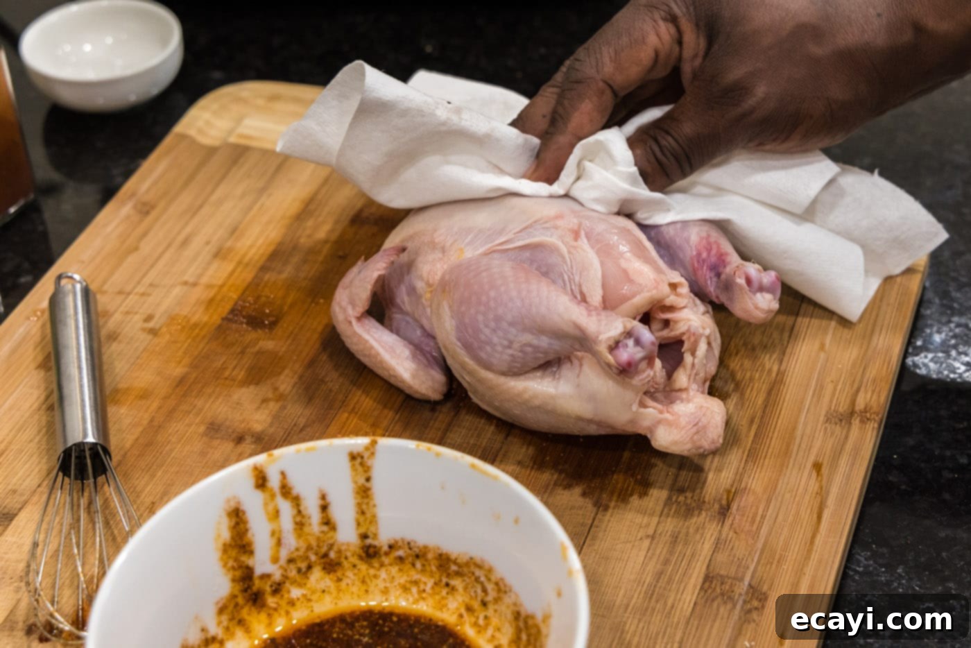 Crispy Golden Cornish Hens 7 dabbing cornish hen dry with a paper towel for crispy skin