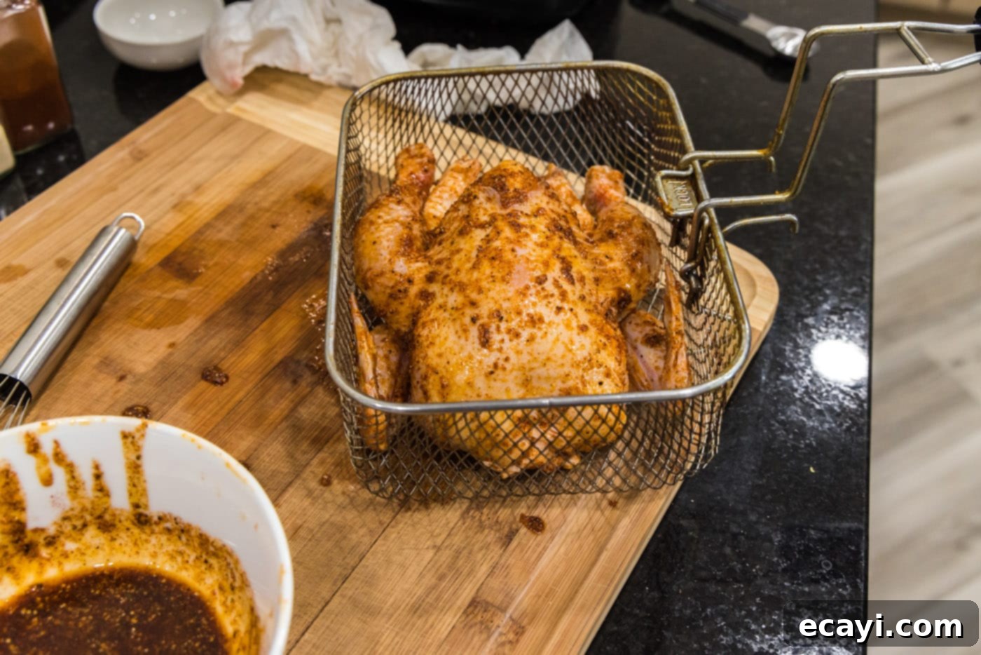 Crispy Golden Cornish Hens 9 cornish hen placed carefully in a deep fryer basket