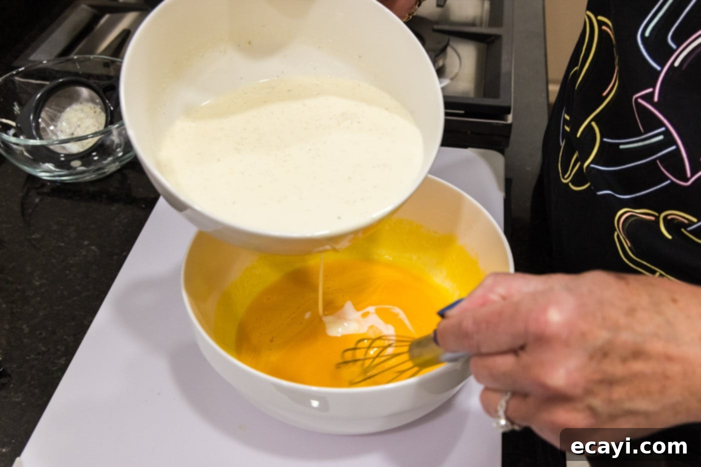 Creme Brulee 13 slowly whisking heavy cream mixture into egg yolks