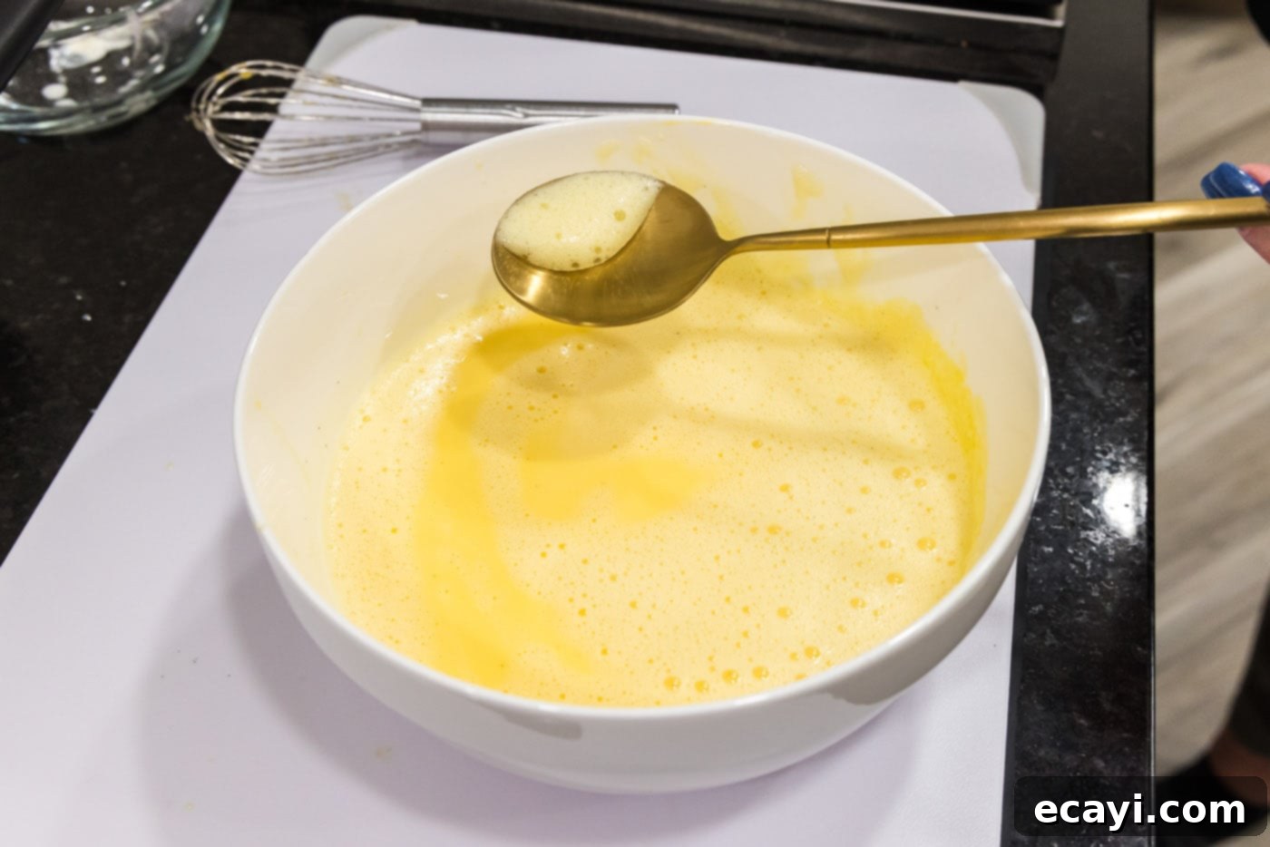 Creme Brulee 14 scooping froth from egg mixture