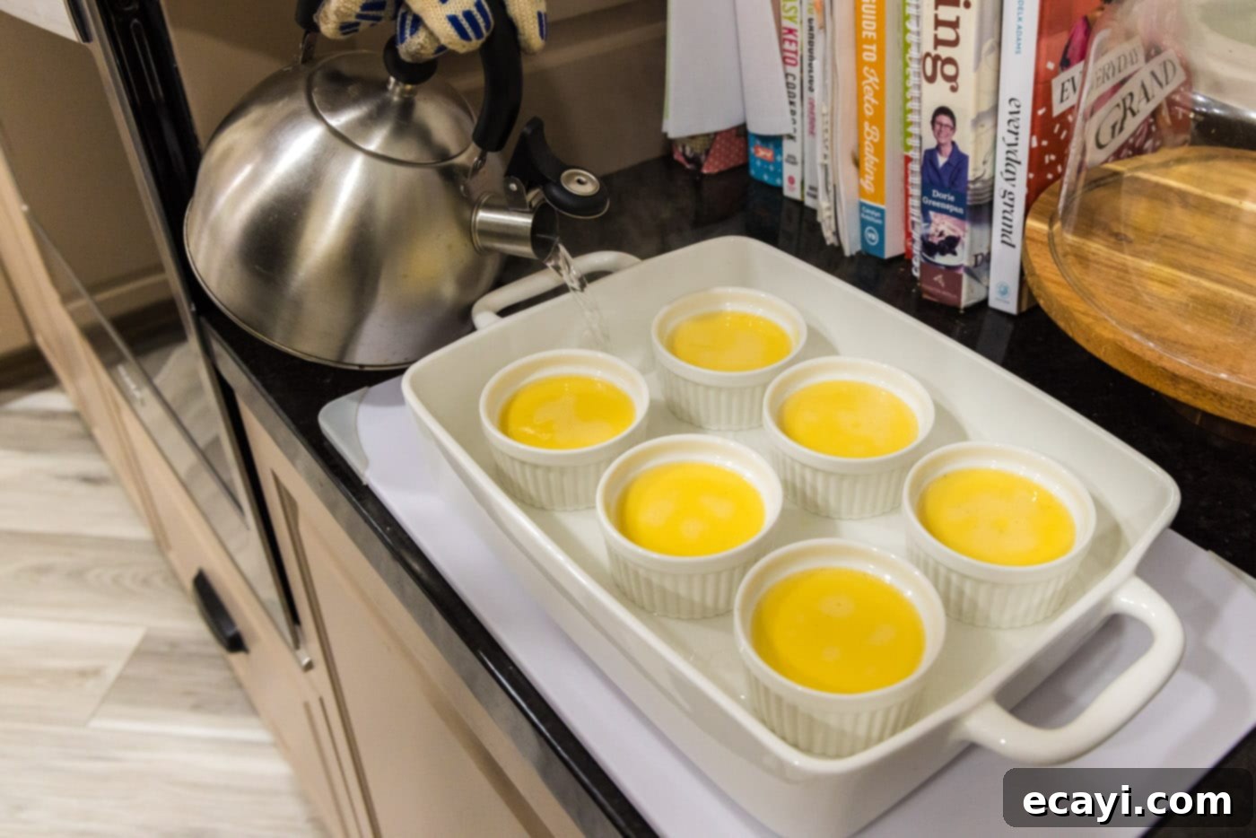 Creme Brulee 16 pouring water into baking dish with creme brulee