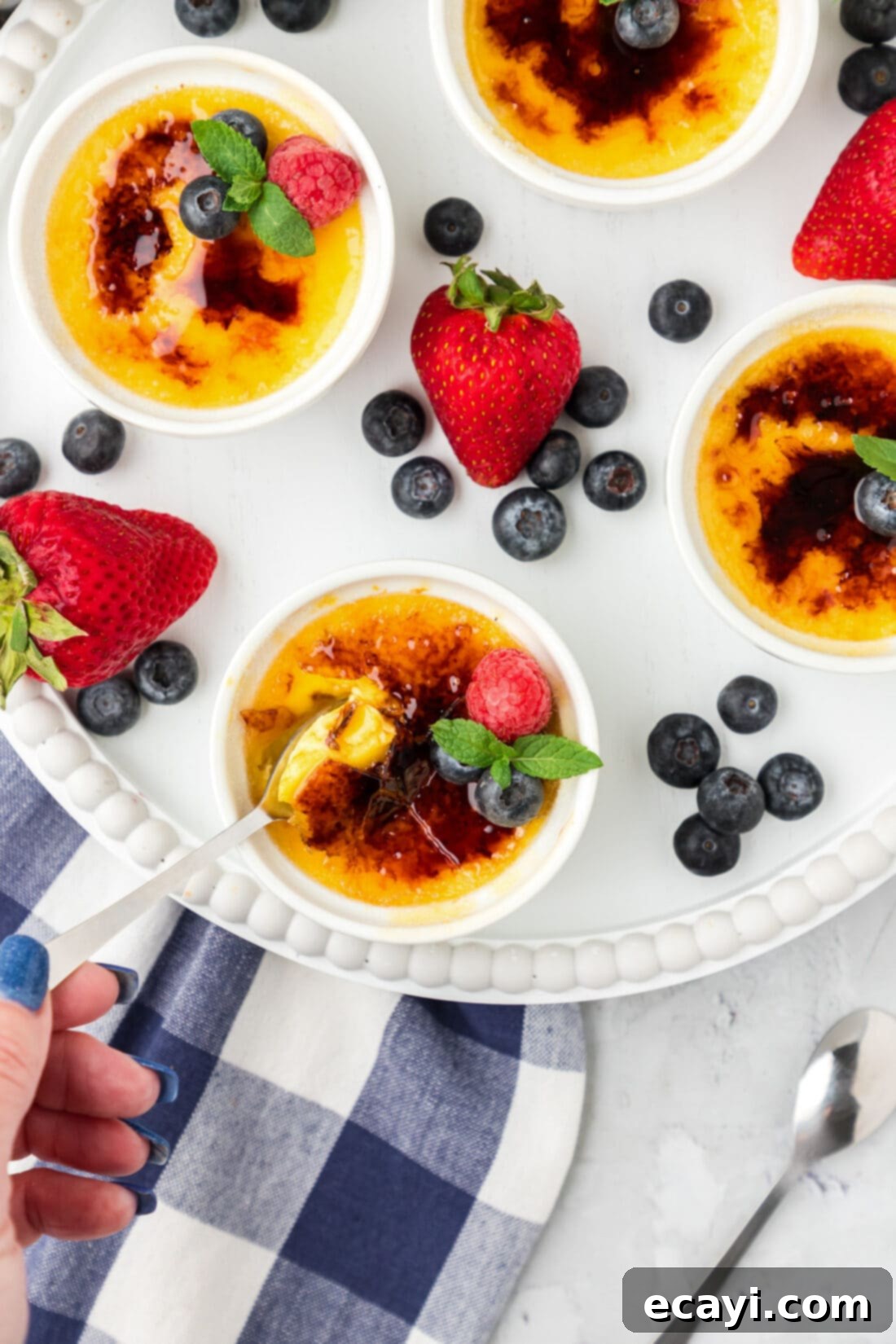 Creme Brulee 3 Spoon dipping into a Creme Brulee
