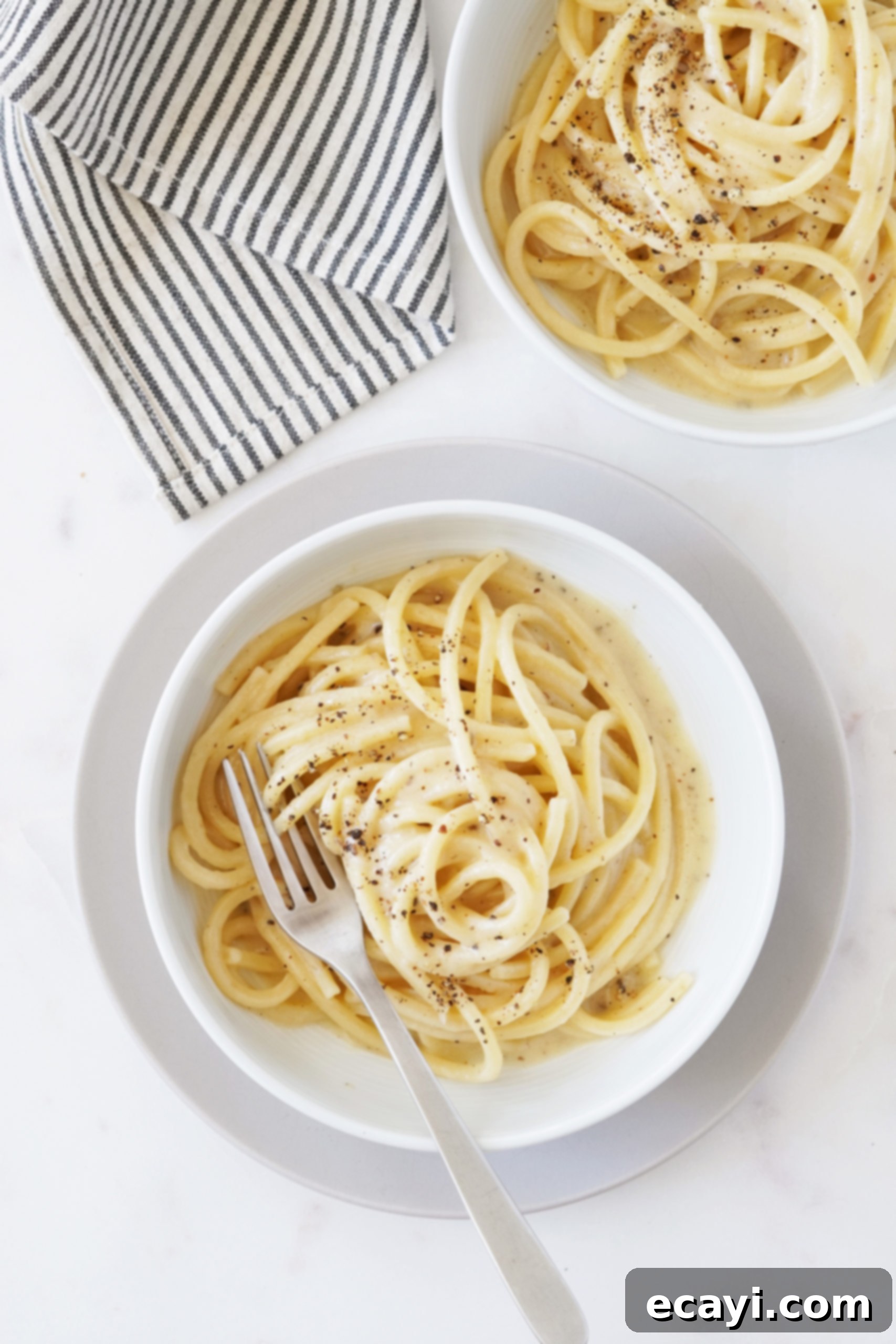 The Secret to Perfect Cacio e Pepe 7 Servings of creamy Cacio e Pepe pasta, a classic Roman dish