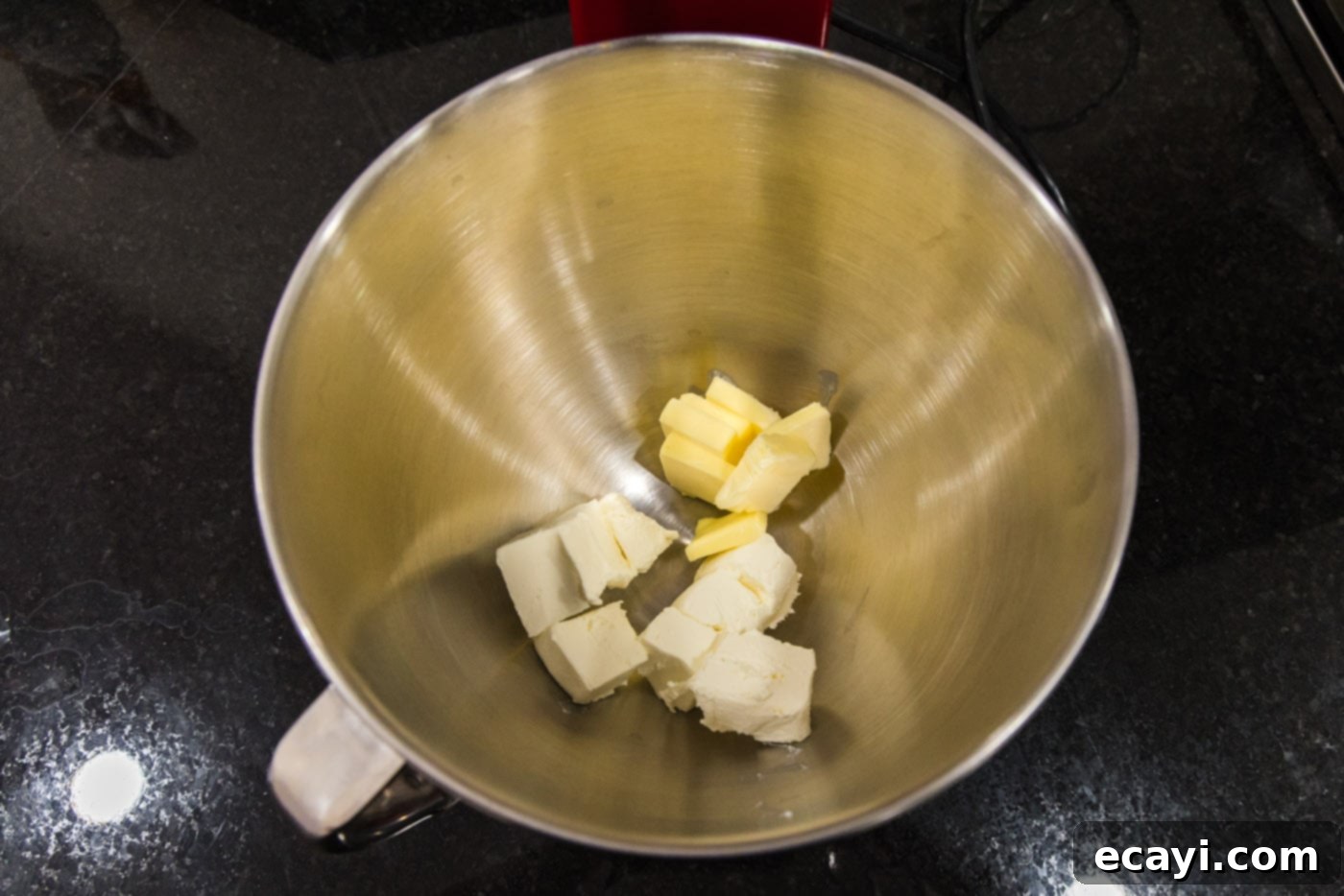 Peanut Butter Bliss 5 butter and cream cheese in a bowl of a stand mixer