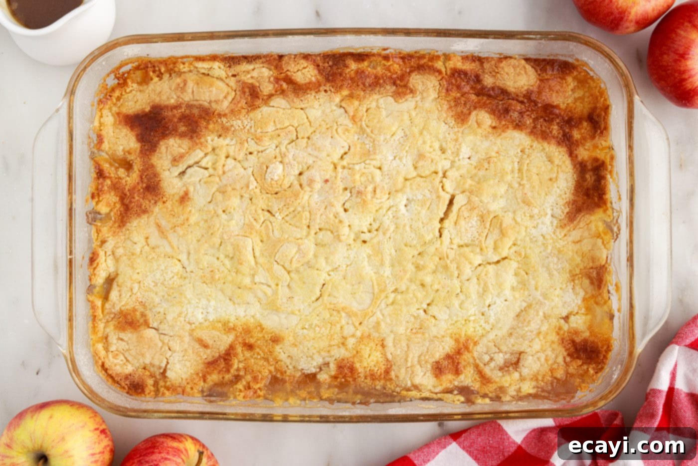 Golden Apple Streusel Bake 8 easy apple dump cake baking in a glass baking dish, showing a golden brown topping and bubbling filling
