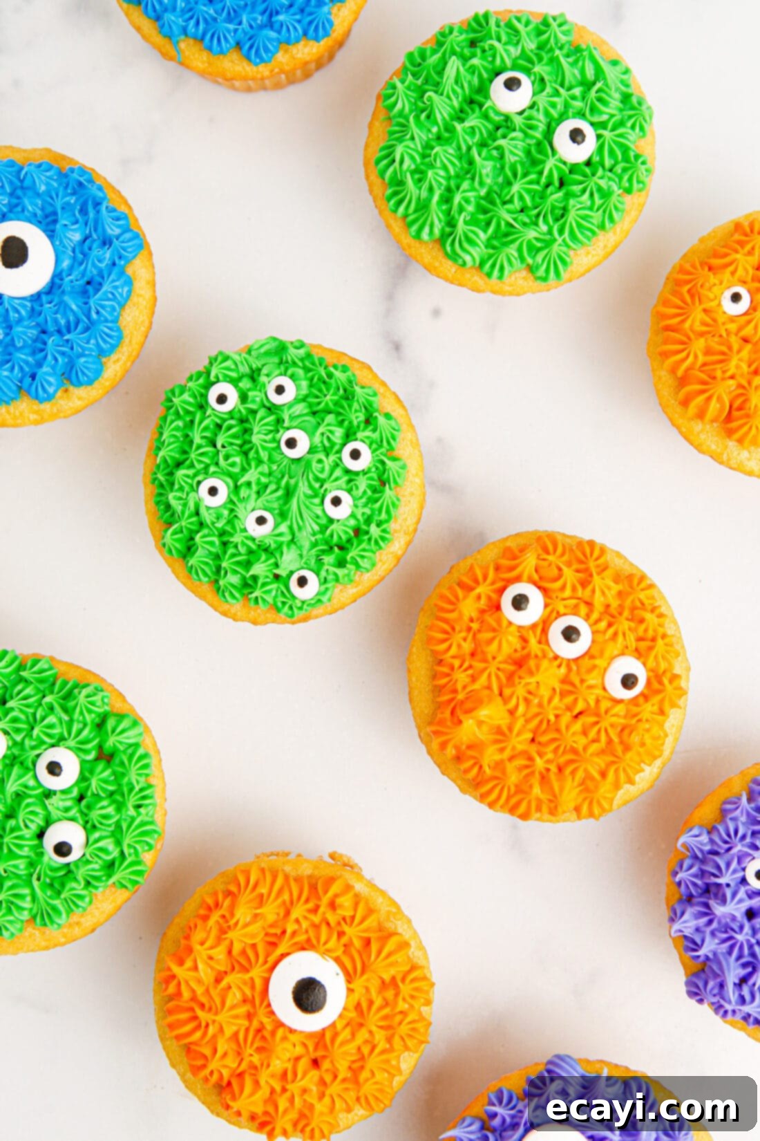Ghoul-icious Cupcakes 11 Overhead photo of Monster Cupcakes, showing a variety of colorful monsters