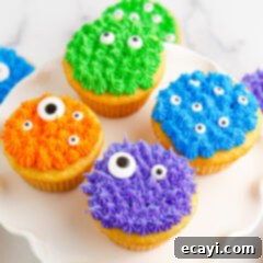 Ghoul-icious Cupcakes 12 Close up photo of Monster Cupcakes on a cake stand
