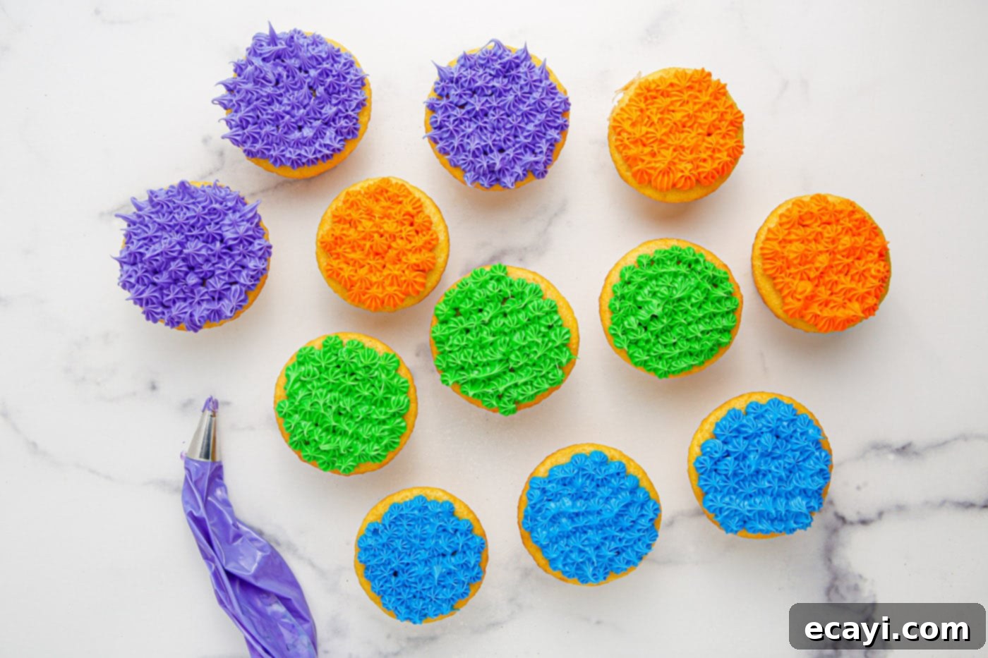 Ghoul-icious Cupcakes 9 Cupcakes decorated with colorful piped frosting