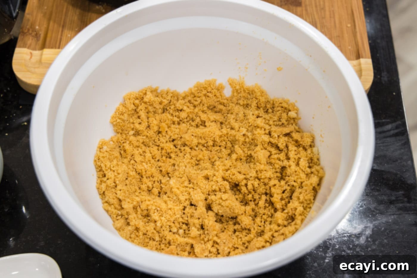 Creamy Baked Corn 7 Buttery Ritz cracker topping in a white bowl, ready for the scalloped corn casserole
