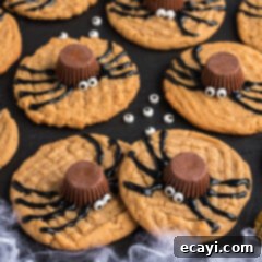 Spooky Spider Cookies 18 Spider Cookies on a black platter with candy eyes scattered around