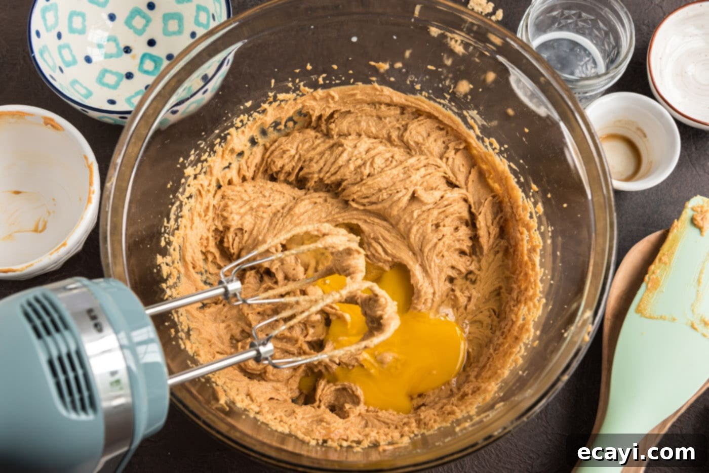 Spooky Spider Cookies 6 adding egg to peanut butter cookie dough with a mixer