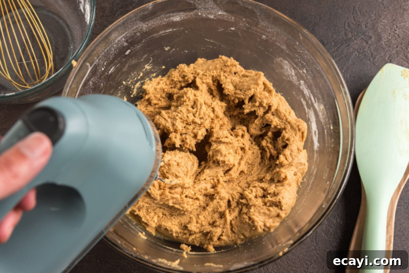 Spooky Spider Cookies 9 mixing peanut butter cookie dough with an electric mixer