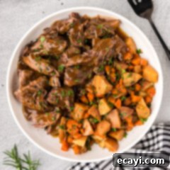 Effortless Instant Pot Roast Beef 14 Bowl of Instant Pot Roast Beef with potatoes and carrots on the side