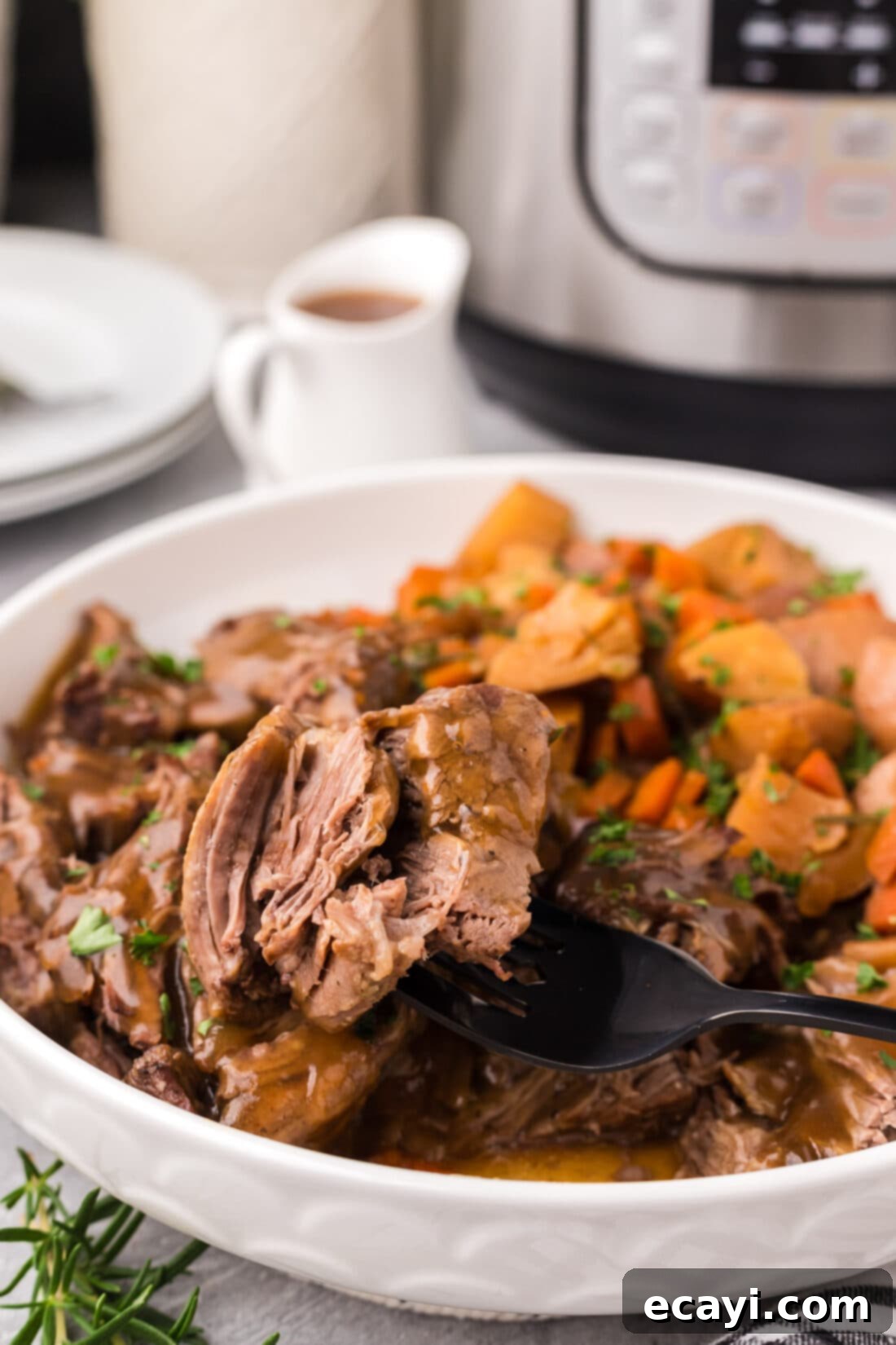 Effortless Instant Pot Roast Beef 3 Piece of Instant Pot Roast Beef on a fork