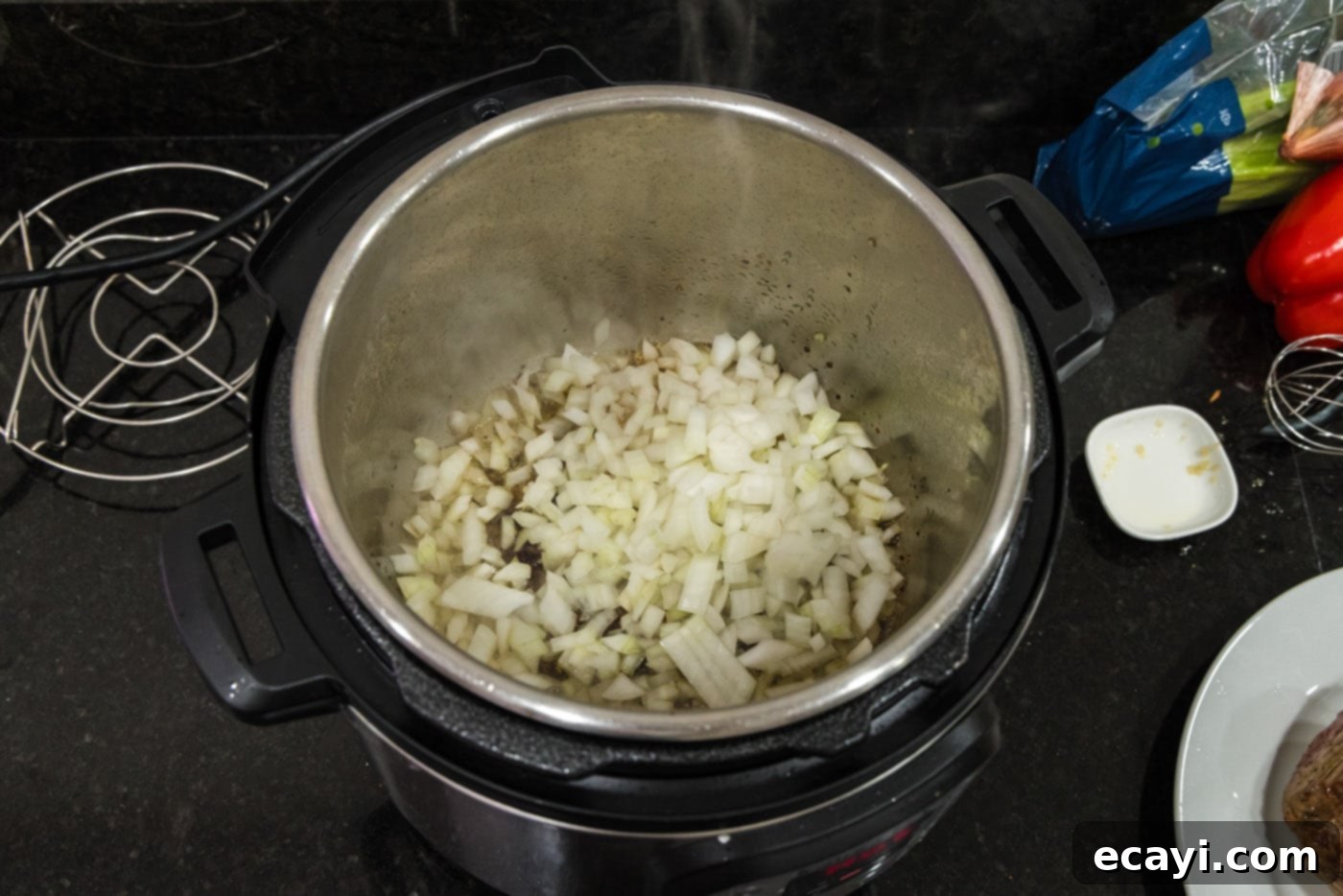 Effortless Instant Pot Roast Beef 8 onion and garlic added to instant pot