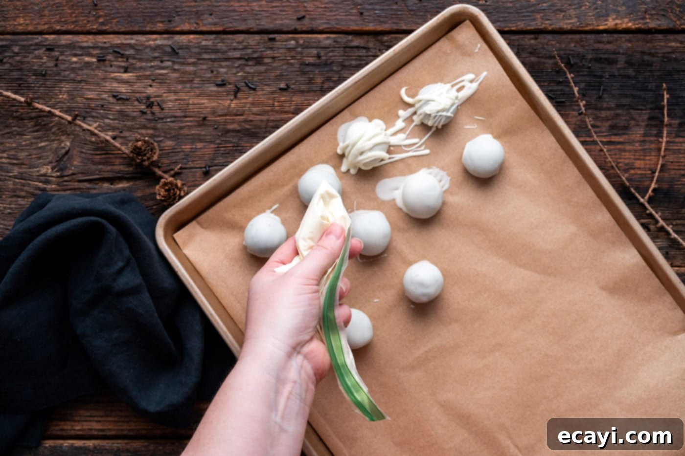 Wicked Oreo Wonders 6 Drizzling white chocolate over Oreo truffles to create mummy bandages