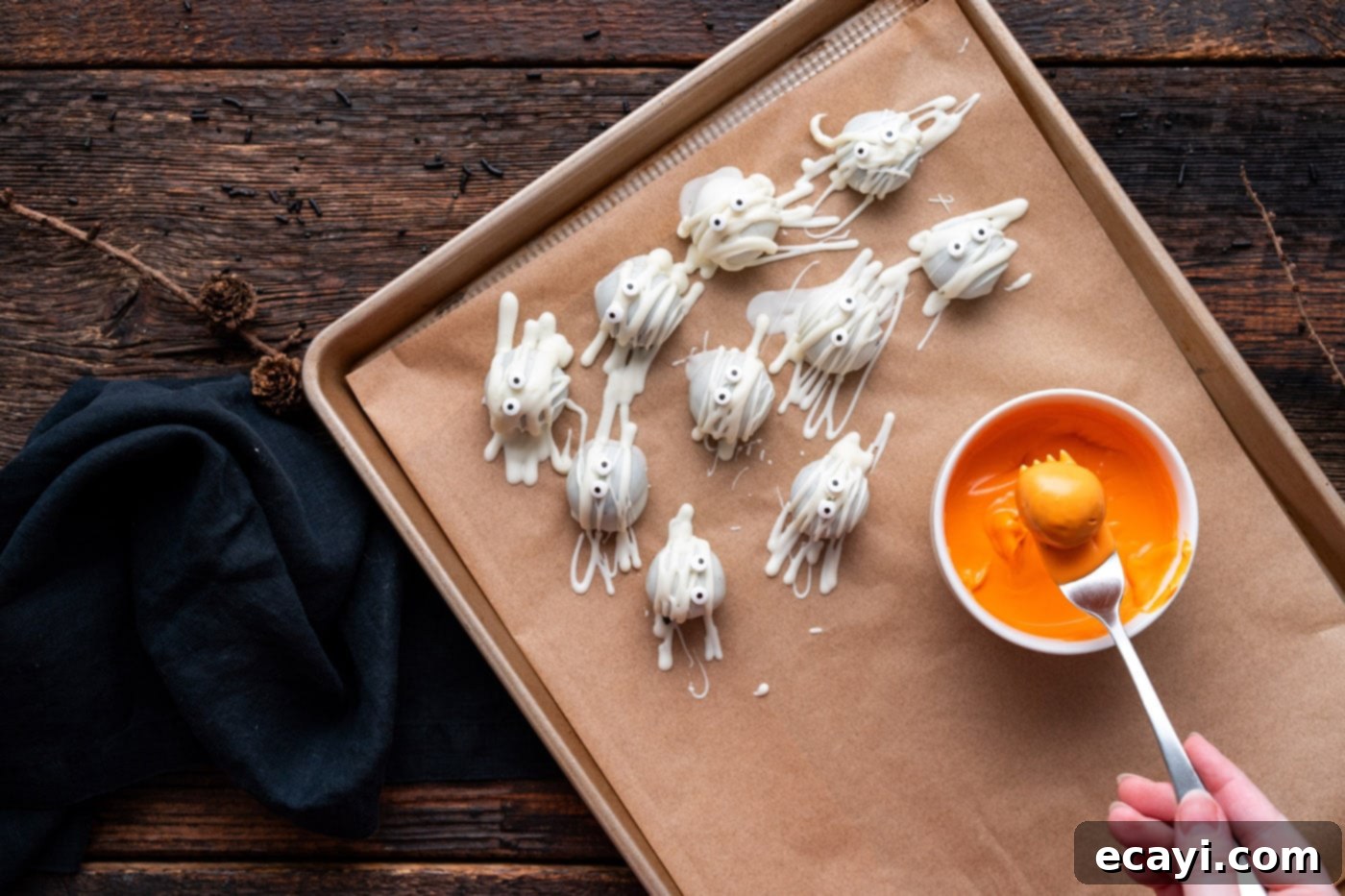 Wicked Oreo Wonders 8 Dipping Oreo truffle into orange candy melts for pumpkin truffles