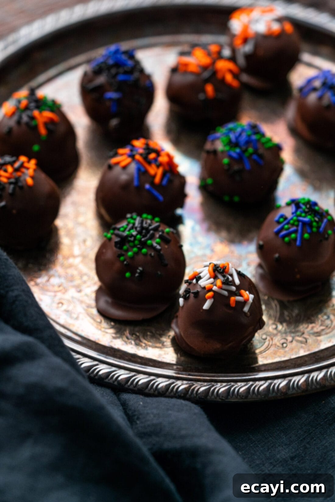 Wicked Oreo Wonders 12 Halloween Oreo Truffles on a silver platter, a collection of different designs
