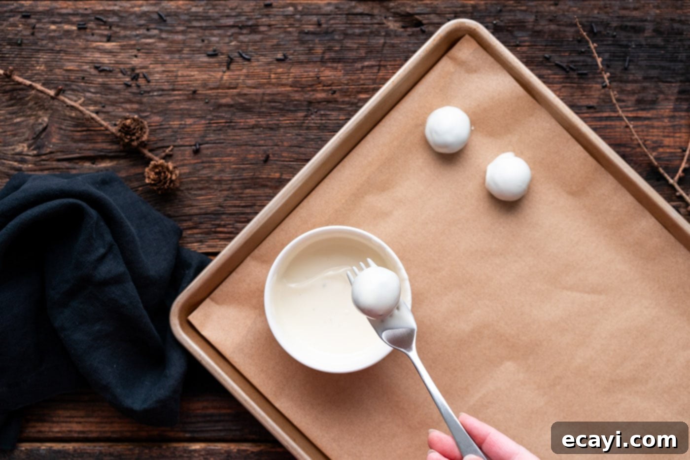 Wicked Oreo Wonders 5 Dipping Oreo truffle into white chocolate, step-by-step for mummy truffles