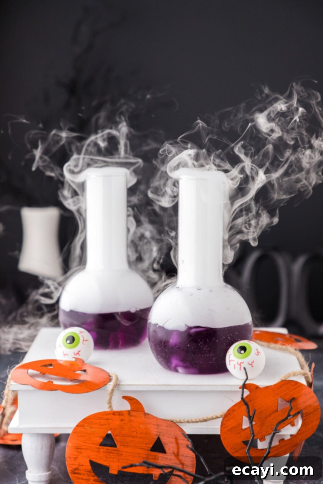 Amethyst Abyss Elixir 10 Two Purple People Eater Cocktails on a decorative tray