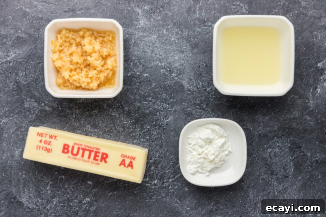 Liquid Gold Garlic Butter 4 Four essential ingredients for Garlic Butter Sauce: butter, minced garlic, a fresh lemon, and a small bowl of cornstarch.