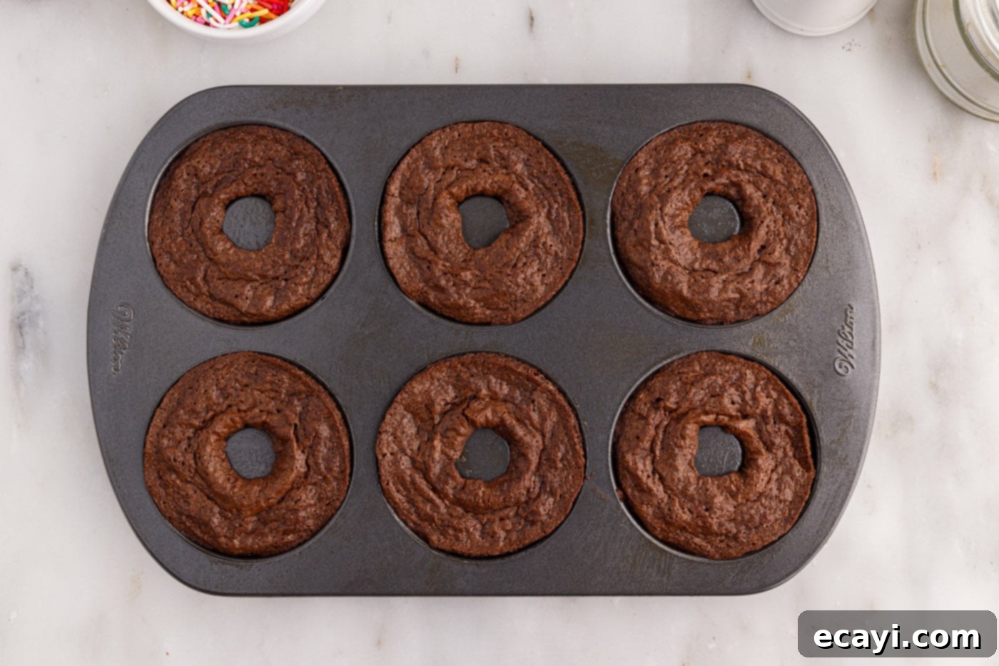 ChocoRings 12 baked bronuts still in the pan, looking perfectly risen and golden brown
