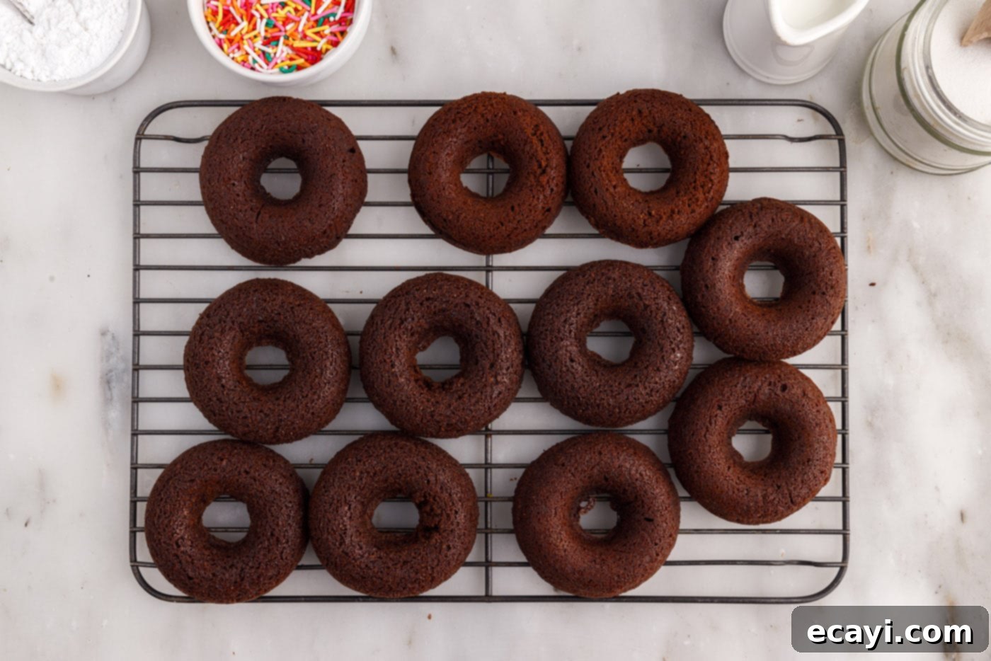 ChocoRings 13 chocolate donuts carefully removed from the pan and placed on a wire cooling rack