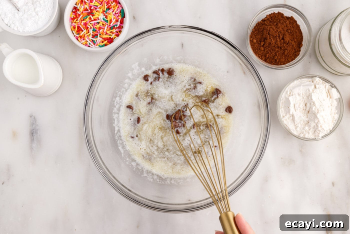 ChocoRings 5 whisking melted butter and chocolate chips together in a bowl until smooth