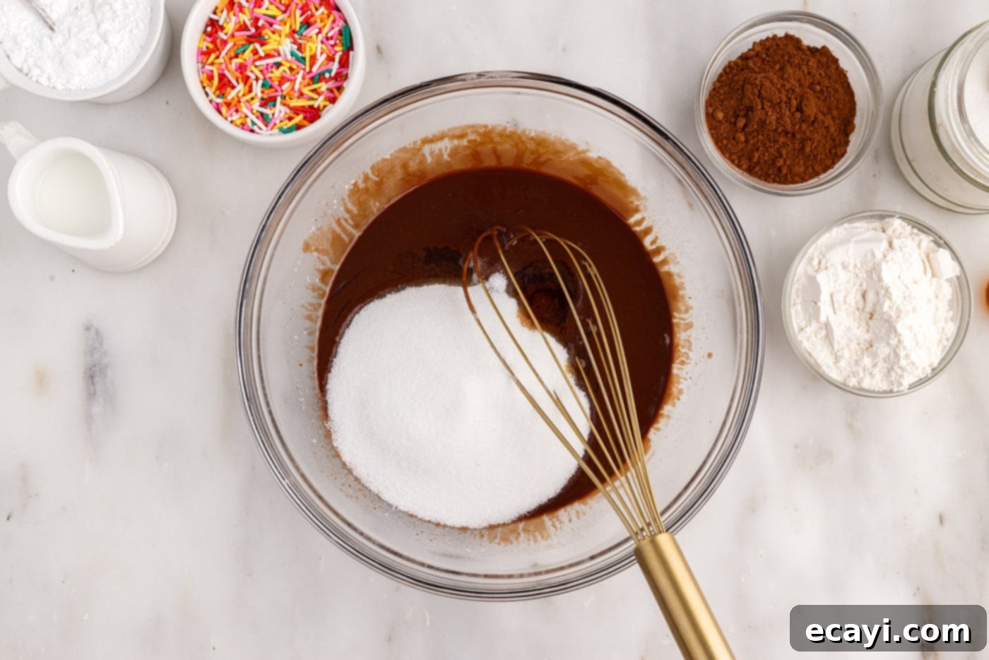 ChocoRings 6 whisking granulated sugar, vanilla extract, and vegetable oil into the chocolate mixture