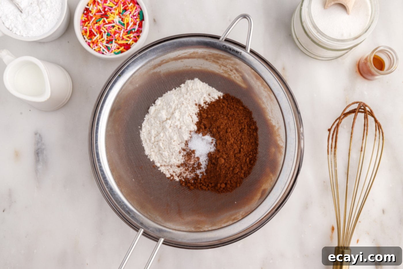 ChocoRings 8 sifting all-purpose flour, salt, and cocoa powder into the bronut batter