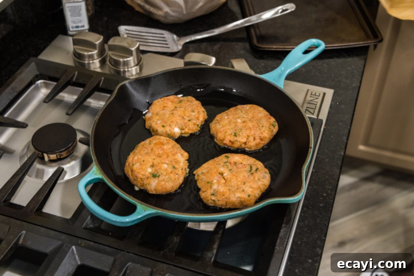 Delicious Salmon Burgers 11 Pan-searing salmon burgers in a hot skillet