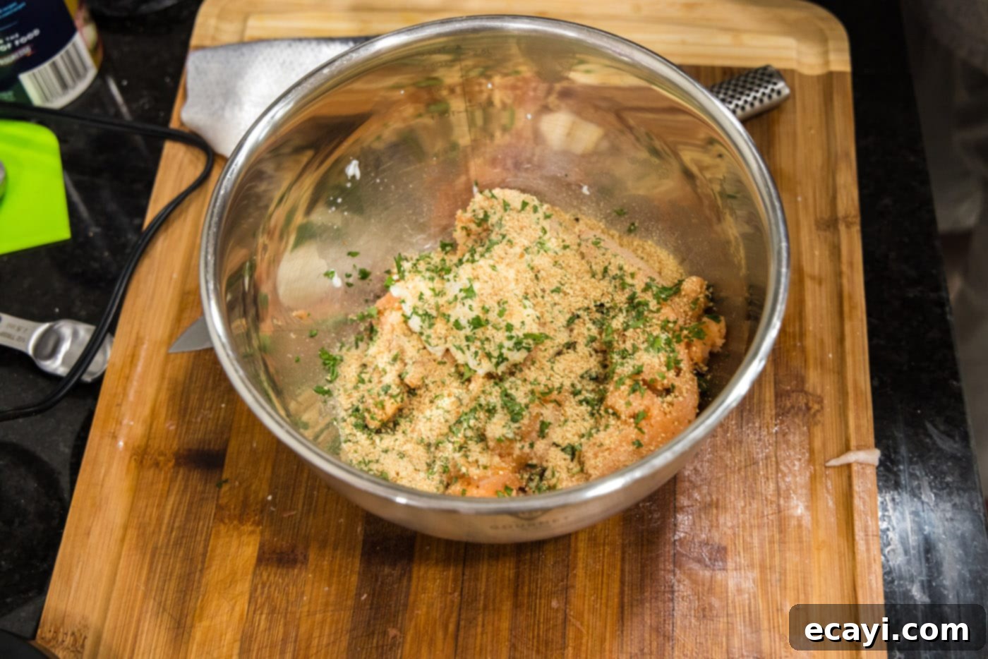 Delicious Salmon Burgers 8 Adding fresh parsley and bread crumbs to the salmon mixture