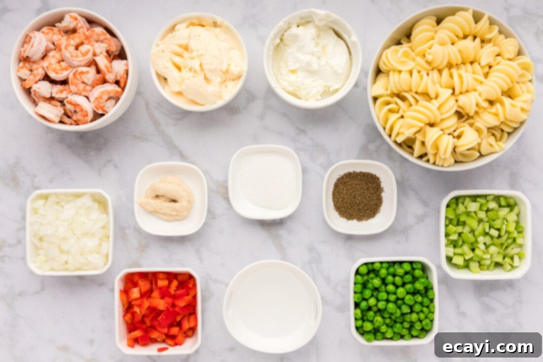 Lemon-Herb Shrimp Pasta Salad 4 A flat lay photograph displaying all the fresh and packaged ingredients laid out for making Shrimp Pasta Salad.
