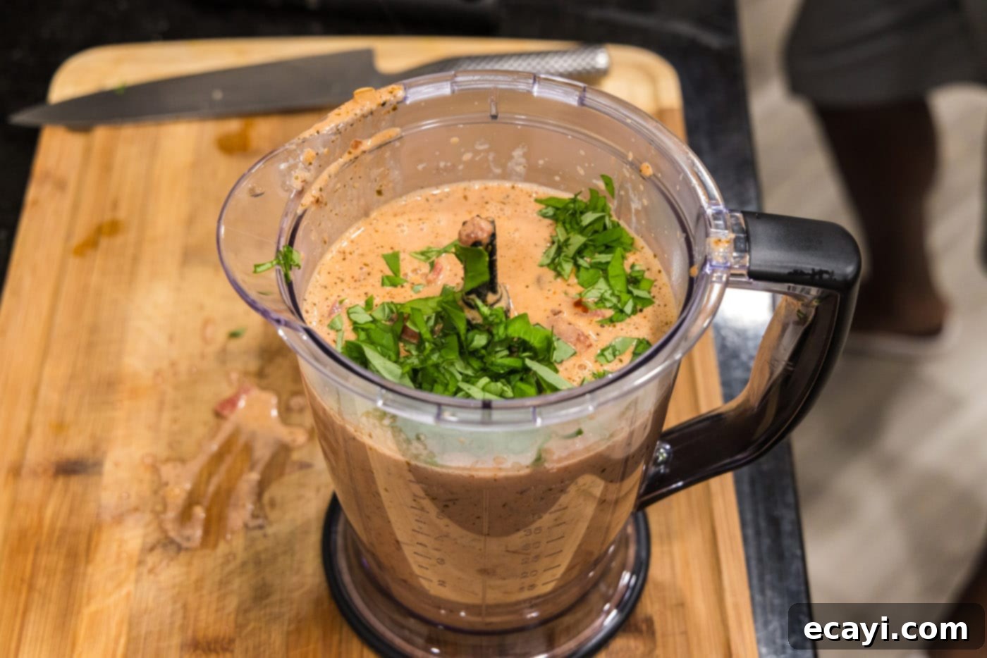 Creamy Vodka Pasta Sauce 12 blitzing homemade vodka sauce in a food processor with fresh basil leaves