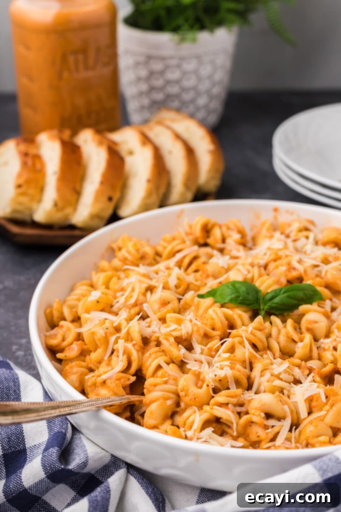 Creamy Vodka Pasta Sauce 14 A beautifully plated bowl of pasta generously covered in Vodka Sauce, garnished with fresh basil, ready to be served.