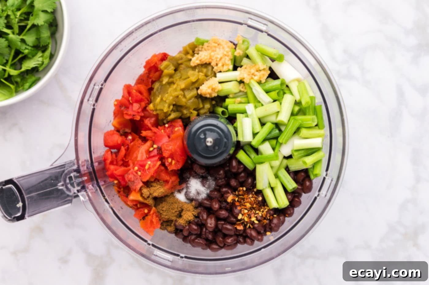 Zesty Black Bean Dip 5 ingredients for black bean dip in a food processor