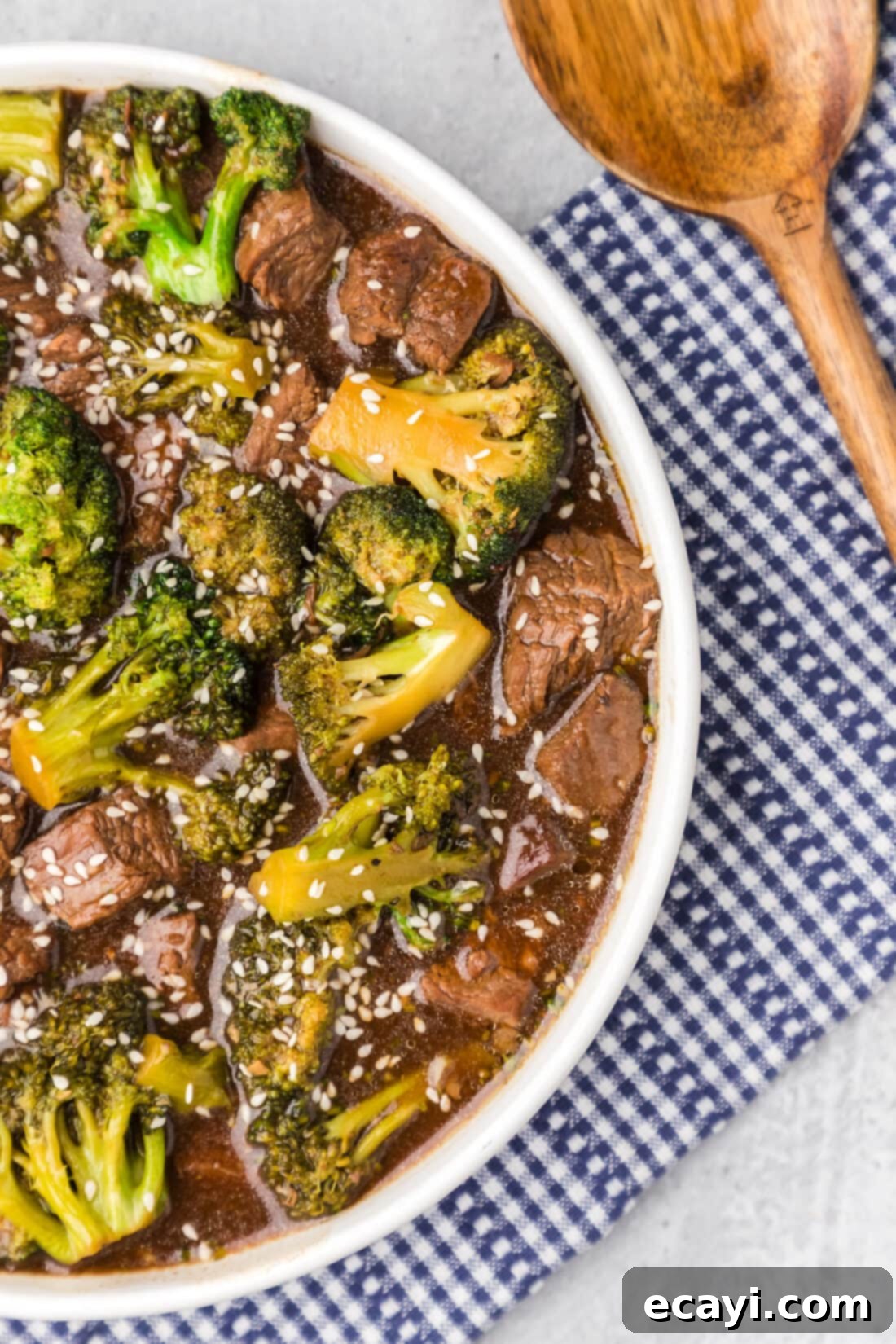 Delicious Instant Pot Beef and Broccoli 2 A close-up shot of a steaming bowl of Instant Pot Beef and Broccoli, showcasing tender beef slices, bright green broccoli florets, and a rich, glossy sauce, ready to be served.