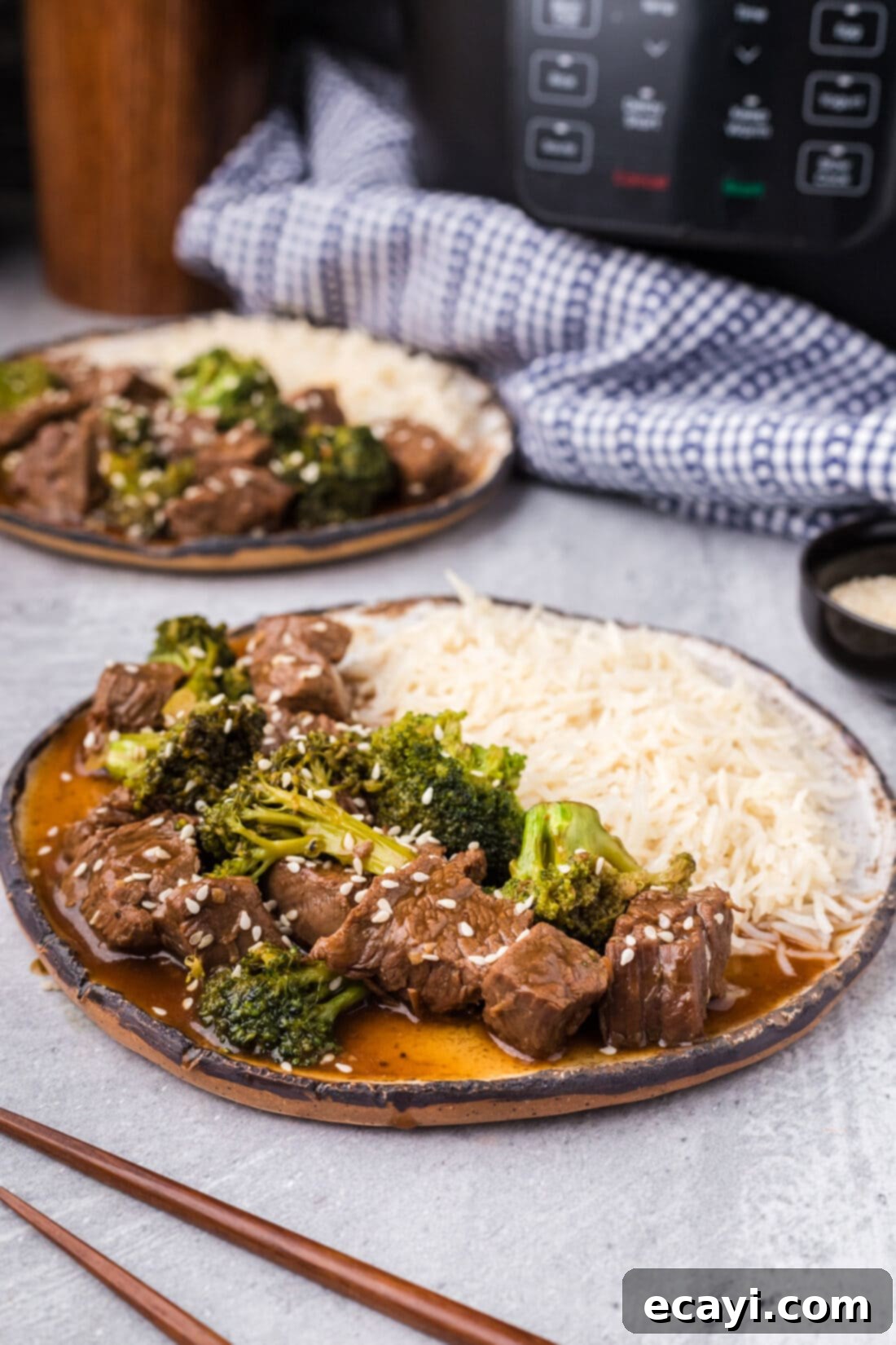 Delicious Instant Pot Beef and Broccoli 3 A serving of Instant Pot Beef and Broccoli plated beautifully alongside fluffy white rice, ready for a delicious meal.
