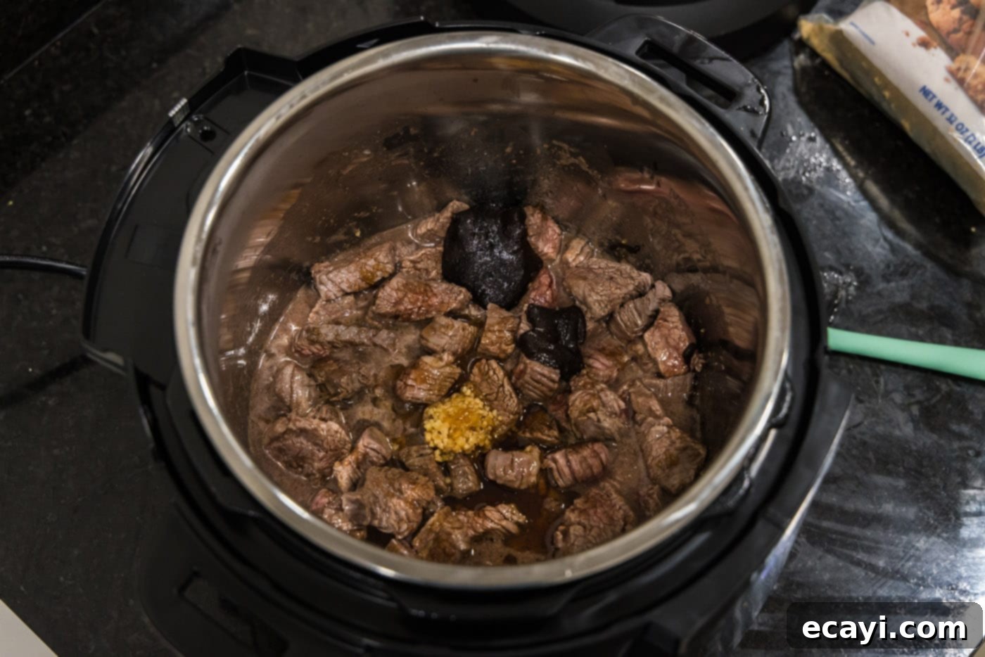 Delicious Instant Pot Beef and Broccoli 8 Sautéed flank steak cubes tossed with aromatic minced garlic, sweet brown sugar, smoky liquid smoke, and rich beef base in the Instant Pot.