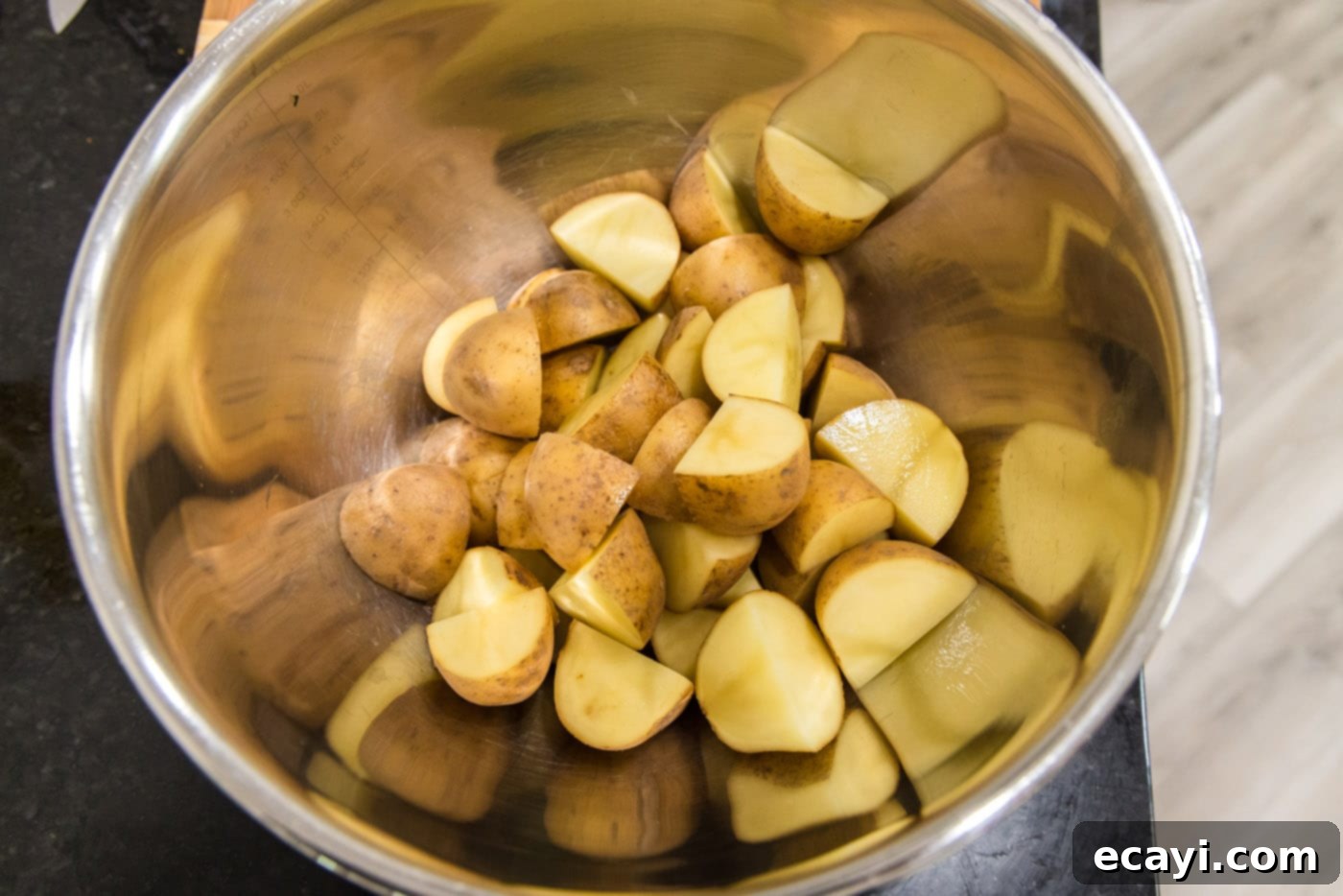 Fiery Roasted Potatoes 5 quartered yukon gold potatoes in a mixing bowl