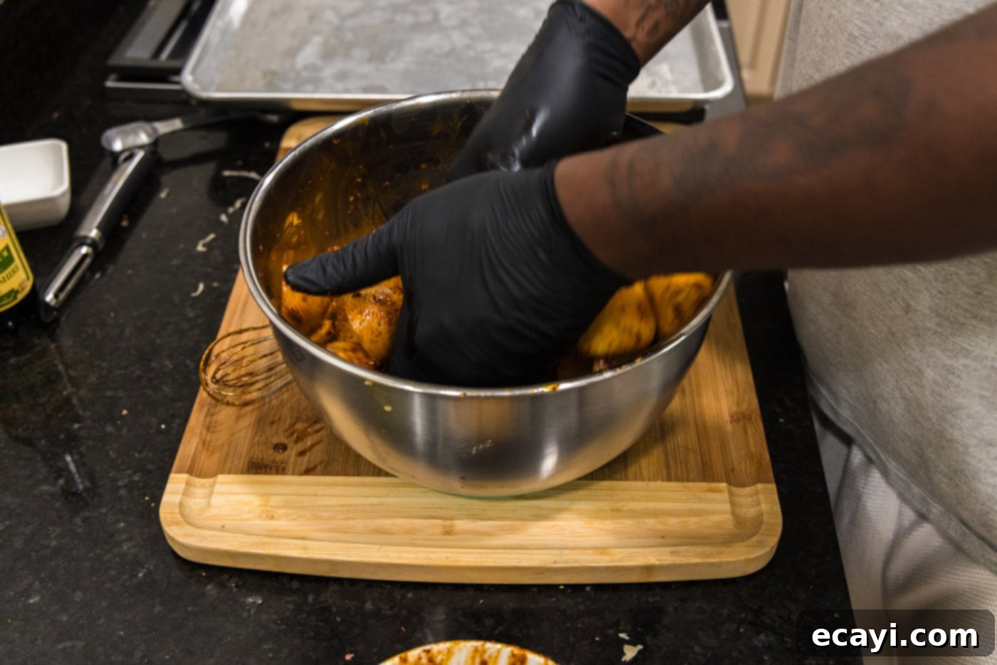 Fiery Roasted Potatoes 7 hands tossing potatoes in spice blend