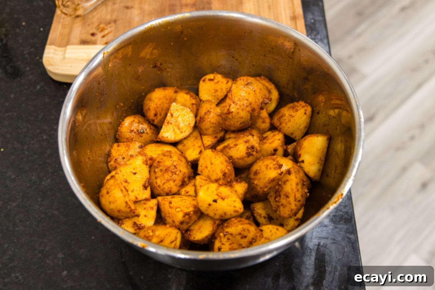 Fiery Roasted Potatoes 8 spicy roast potatoes in a mixing bowl