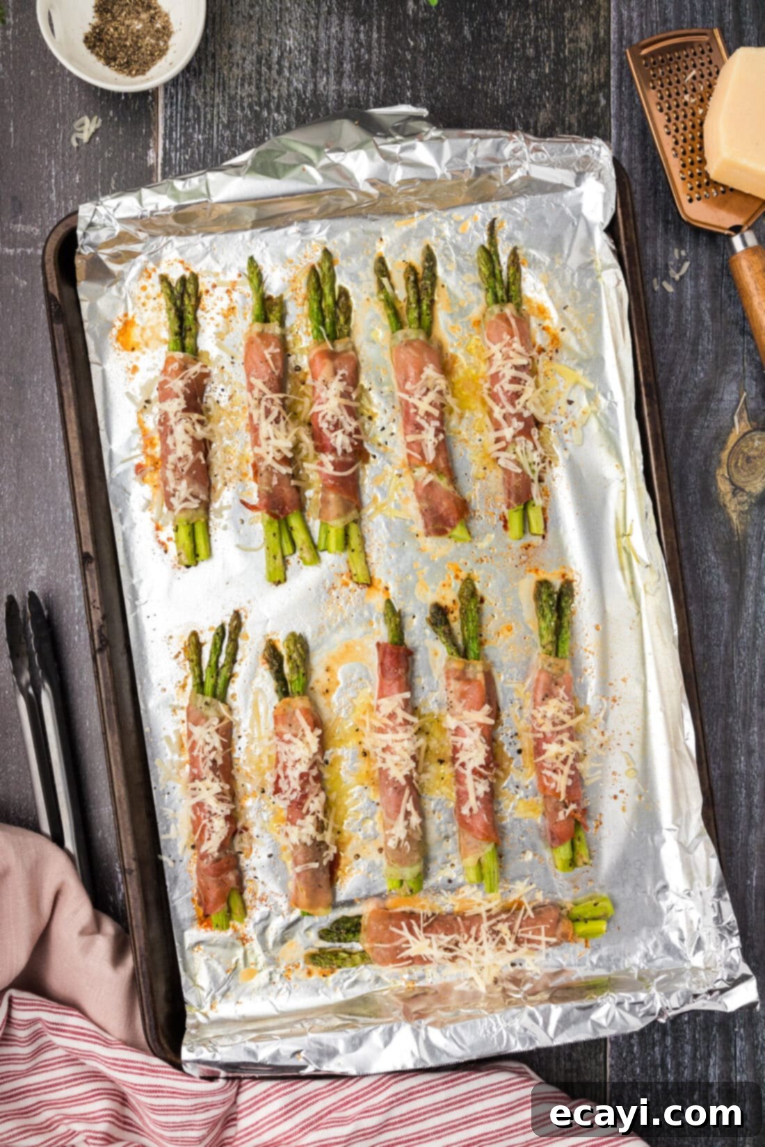 Crispy Prosciutto-Wrapped Asparagus 3 Prosciutto Wrapped Asparagus on a sheet pan