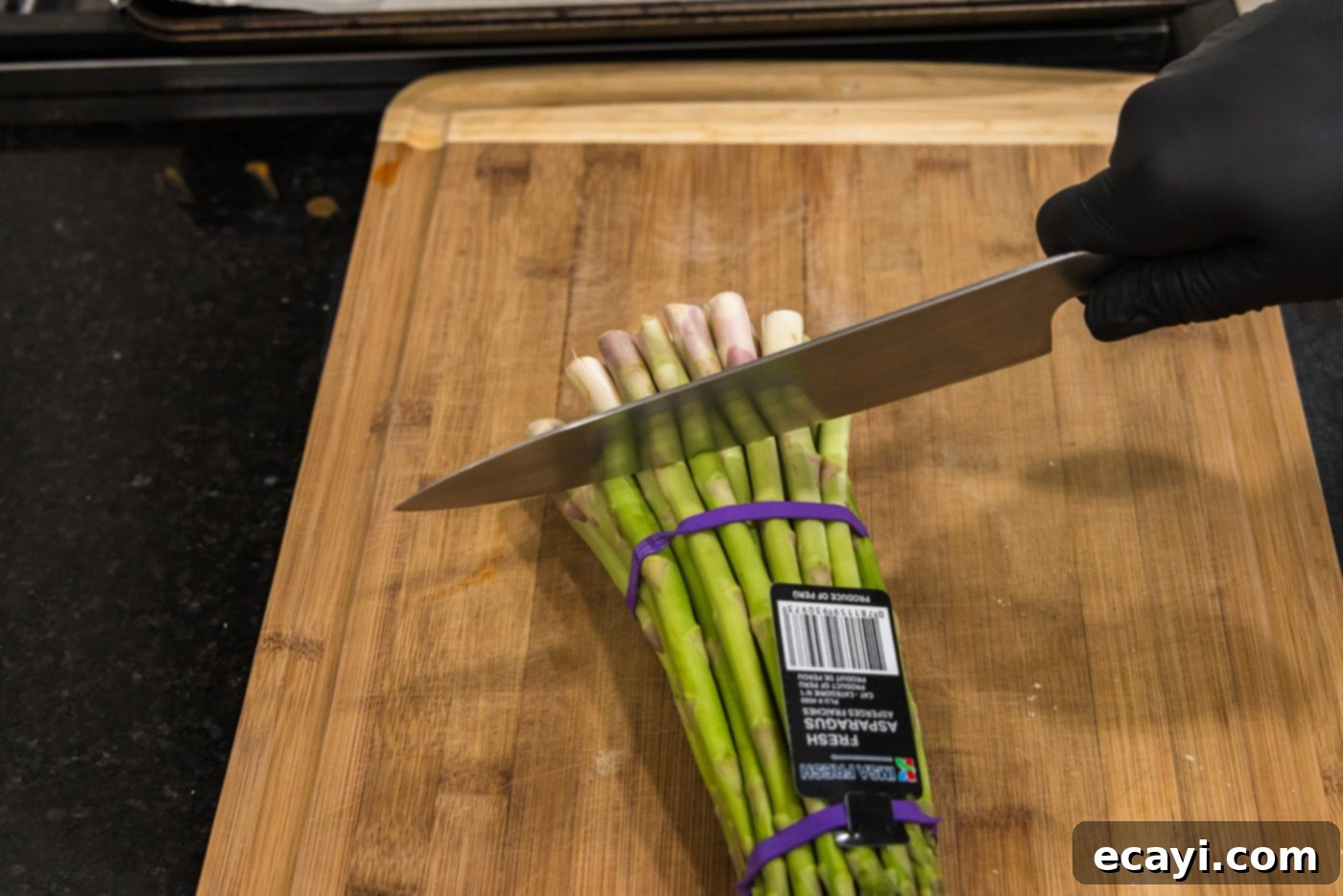 Crispy Prosciutto-Wrapped Asparagus 5 knife cutting woody end of asparagus spears