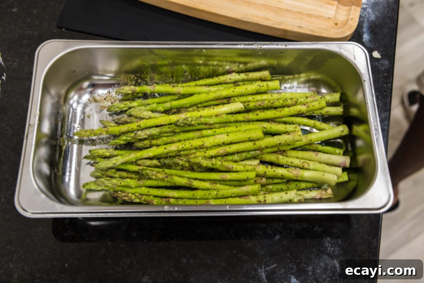 Crispy Prosciutto-Wrapped Asparagus 7 seasoned asparagus spears in a tray