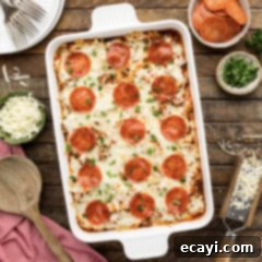 Ultimate Sausage and Pepperoni Pizza Bake 12 Close up photo of a casserole dish of Sausage & Pepperoni Pizza Casserole