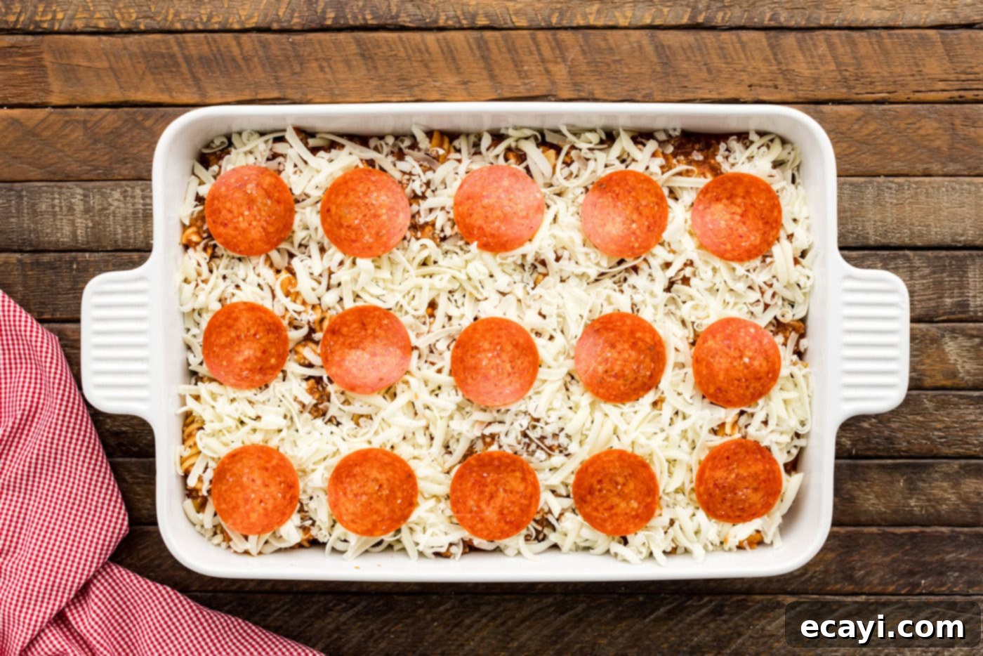 Ultimate Sausage and Pepperoni Pizza Bake 9 pepperoni slices on top of pizza casserole