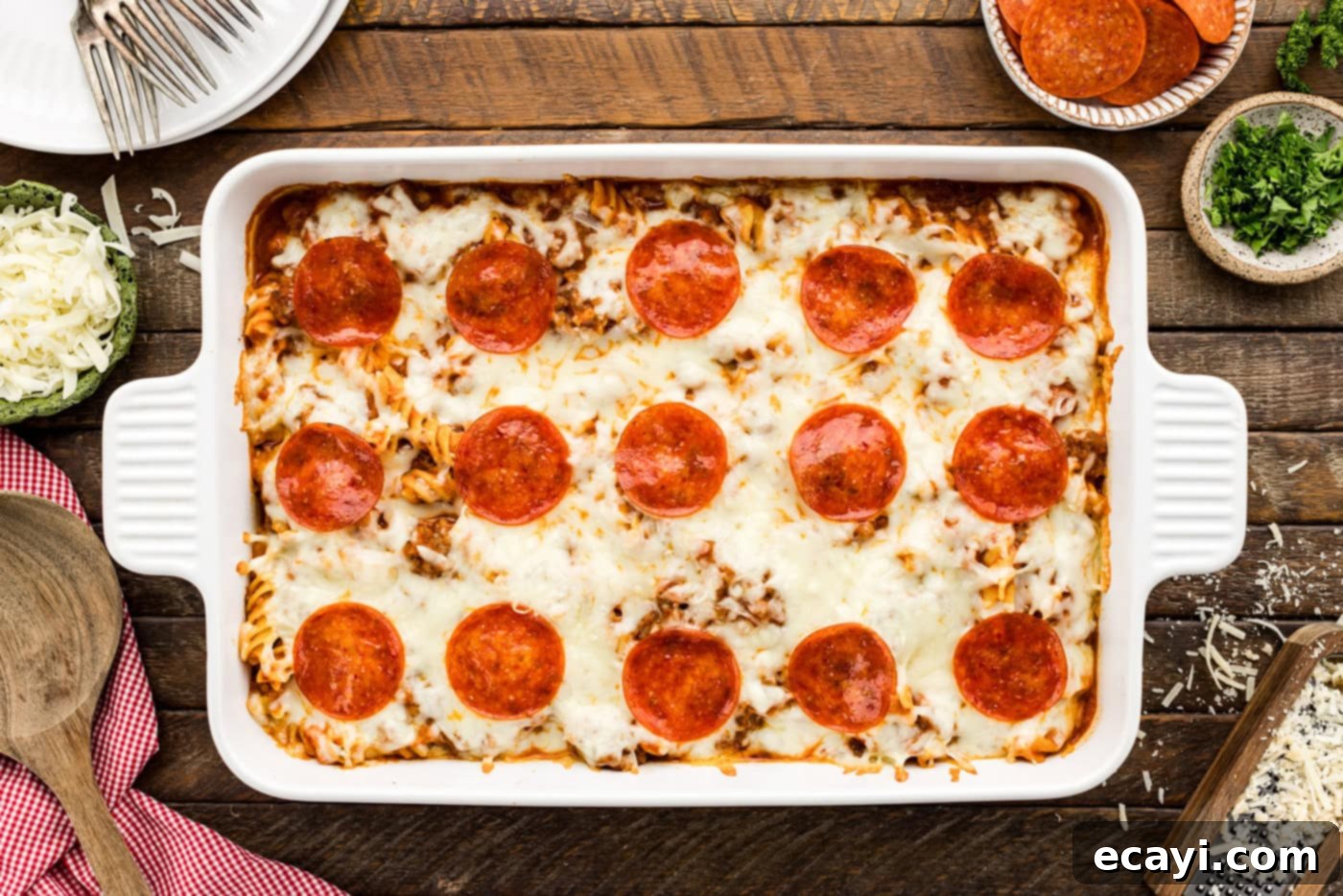 Ultimate Sausage and Pepperoni Pizza Bake 10 overhead of baked pizza casserole in a baking dish