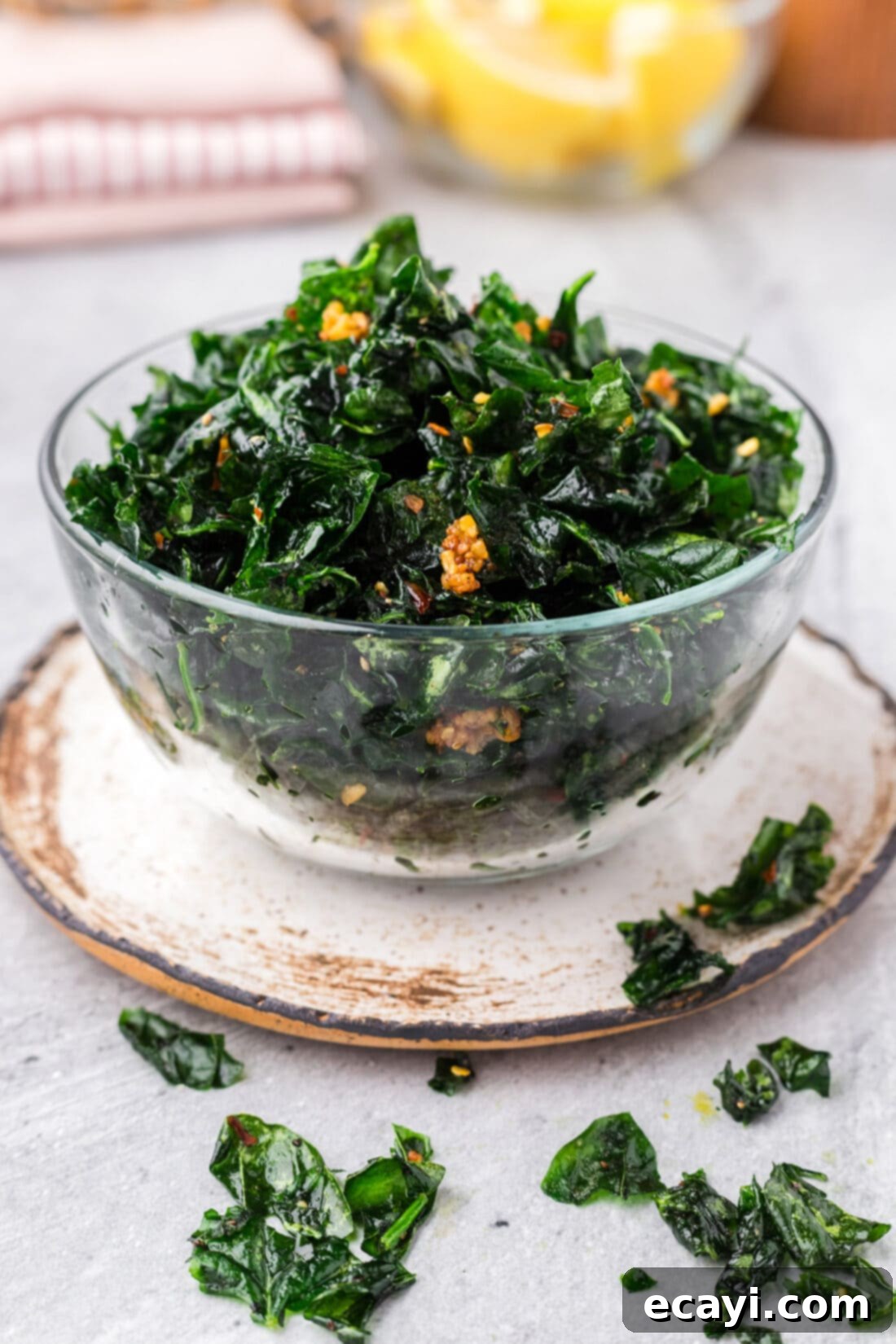 Crispy Spinach Sauté 13 A beautifully presented bowl of Fried Spinach, with some scattered around on a rustic wooden table.