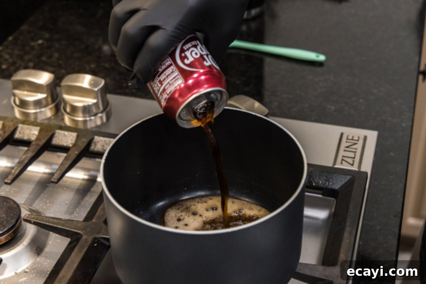 Dr Pepper Infused BBQ Sauce 5 pouring dr. pepper into a saucepan